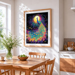 Rainbow peacock under the moon cross stitch artwork displayed on wall as home decor