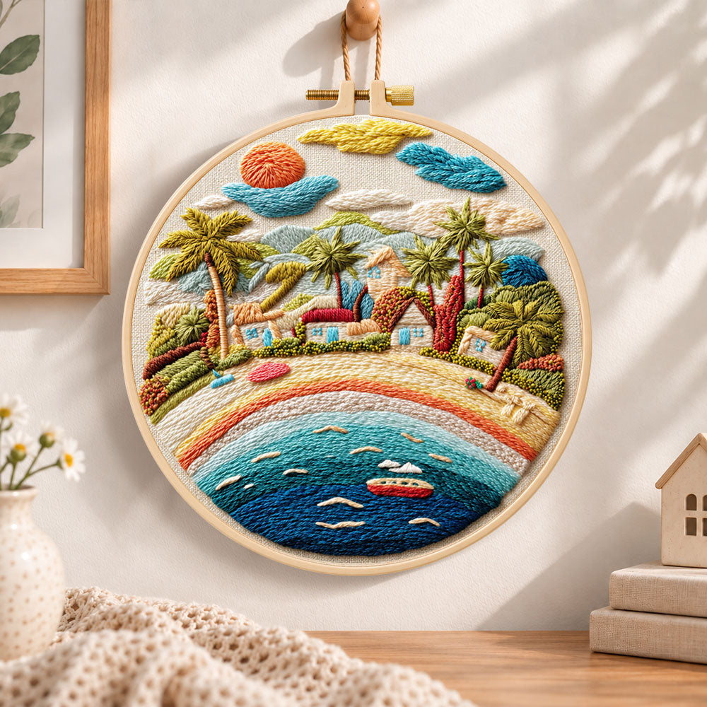 Rainbow seaside village embroidery hoop wall art displayed as warm and cosy handmade home decor