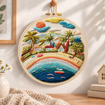 Rainbow seaside village embroidery hoop wall art displayed as warm and cosy handmade home decor