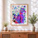 Finished rainbow splash cat cross stitch artwork displayed