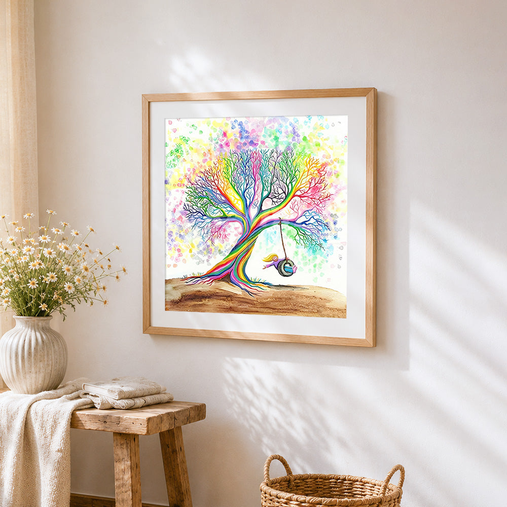 Rainbow tree with girl on swing cross stitch artwork displayed on wall as home decor