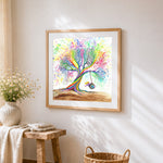 Rainbow tree with girl on swing cross stitch artwork displayed on wall as home decor