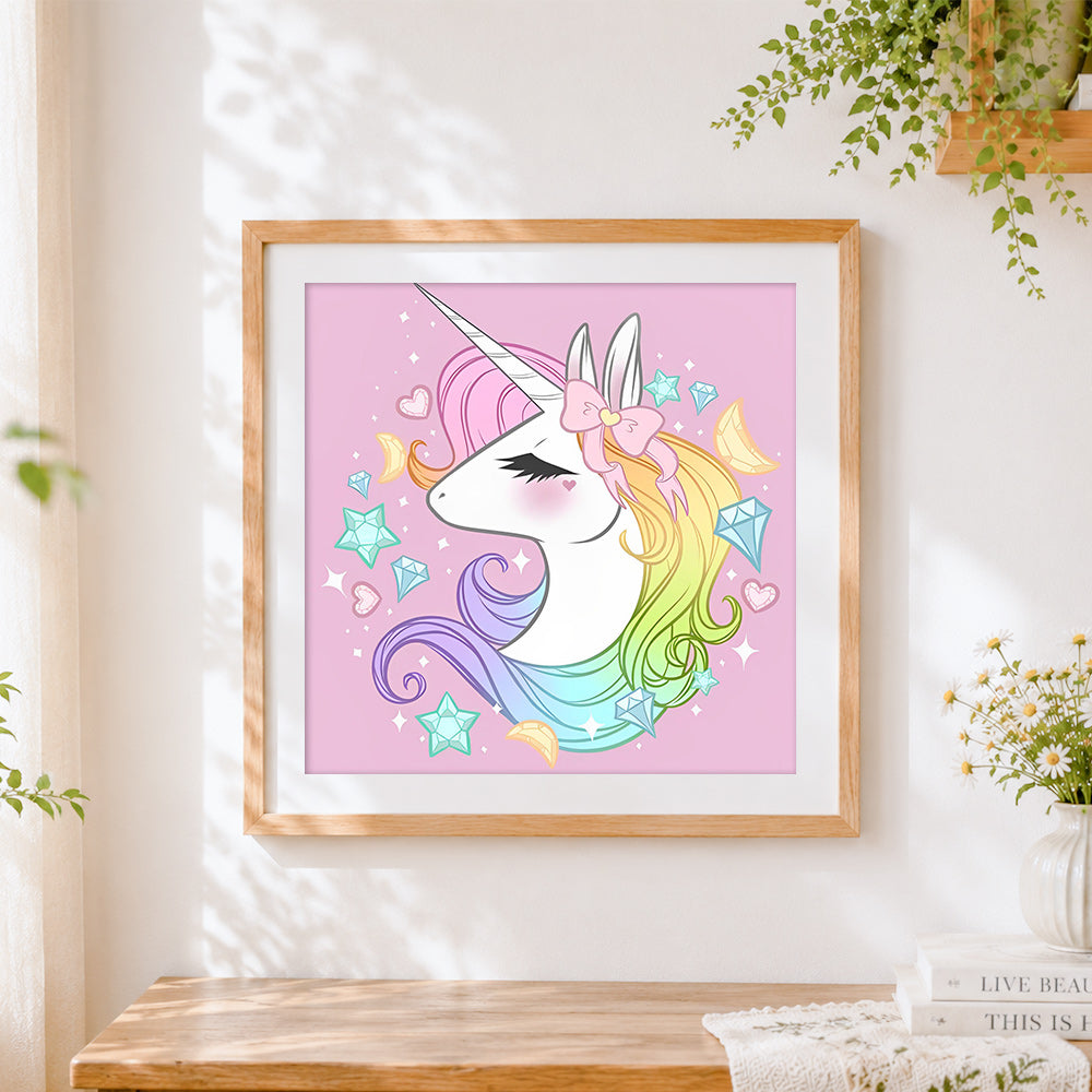 Finished rainbow unicorn with crystals and stars cross stitch artwork displayed