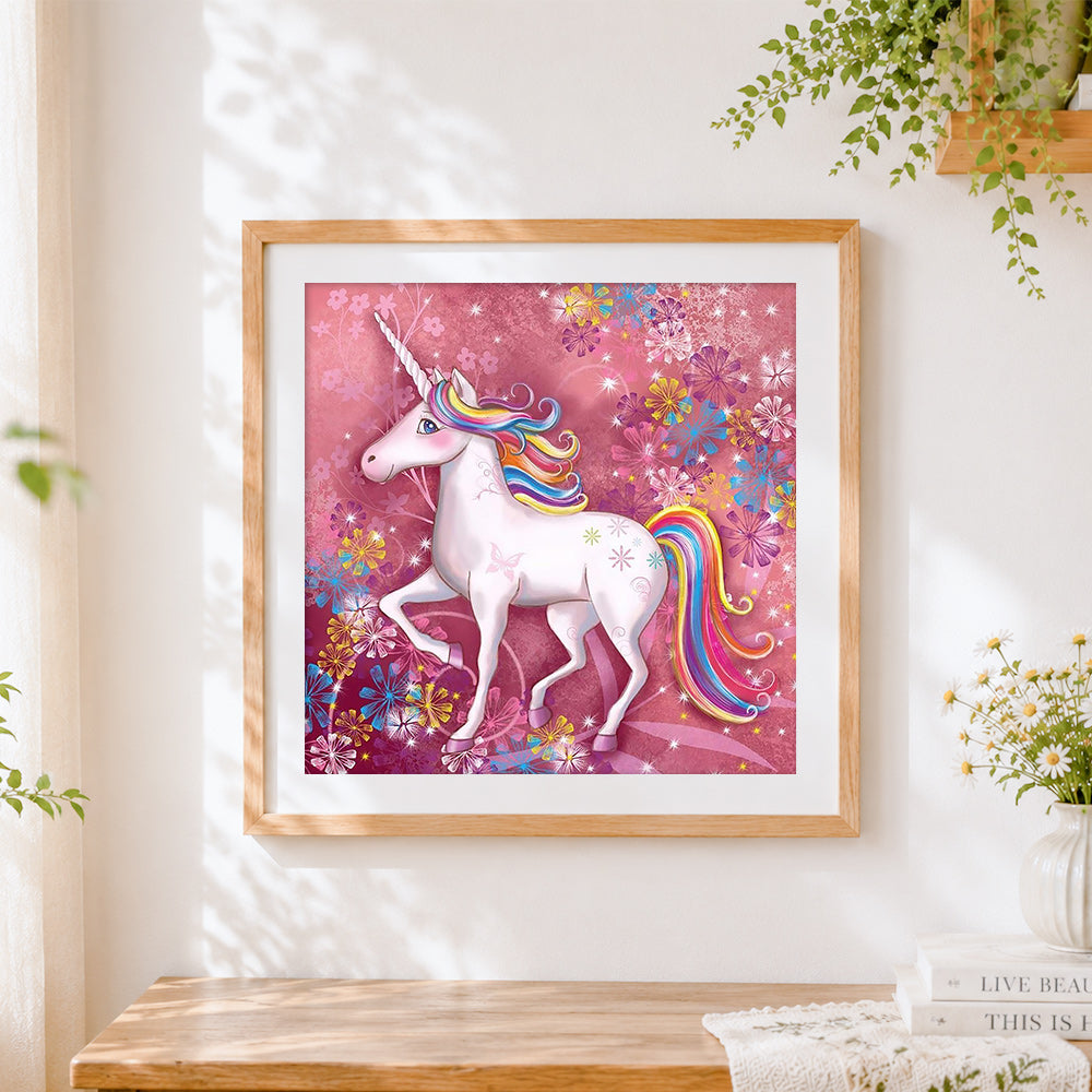 Finished rainbow unicorn with pink floral background cross stitch artwork displayed