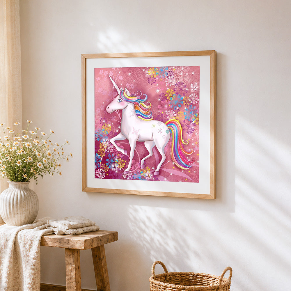 Rainbow unicorn with pink floral background cross stitch artwork displayed on wall as home decor