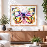 Finished rainbow watercolour butterfly cross stitch artwork displayed