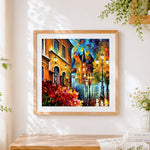 Finished rainy european street cross stitch artwork displayed