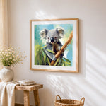 Realistic koala in a tree cross stitch artwork displayed on wall as home decor