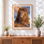 Finished realistic lion cross stitch artwork displayed