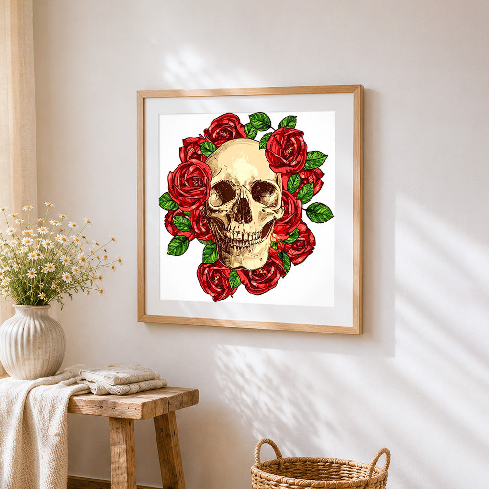 Realistic skull surrounded by red roses cross stitch artwork displayed on wall as home decor