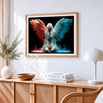 Red and blue winged angel cross stitch artwork displayed on wall as home decor