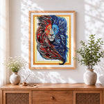 Finished red and blue yin yang lion cross stitch artwork displayed