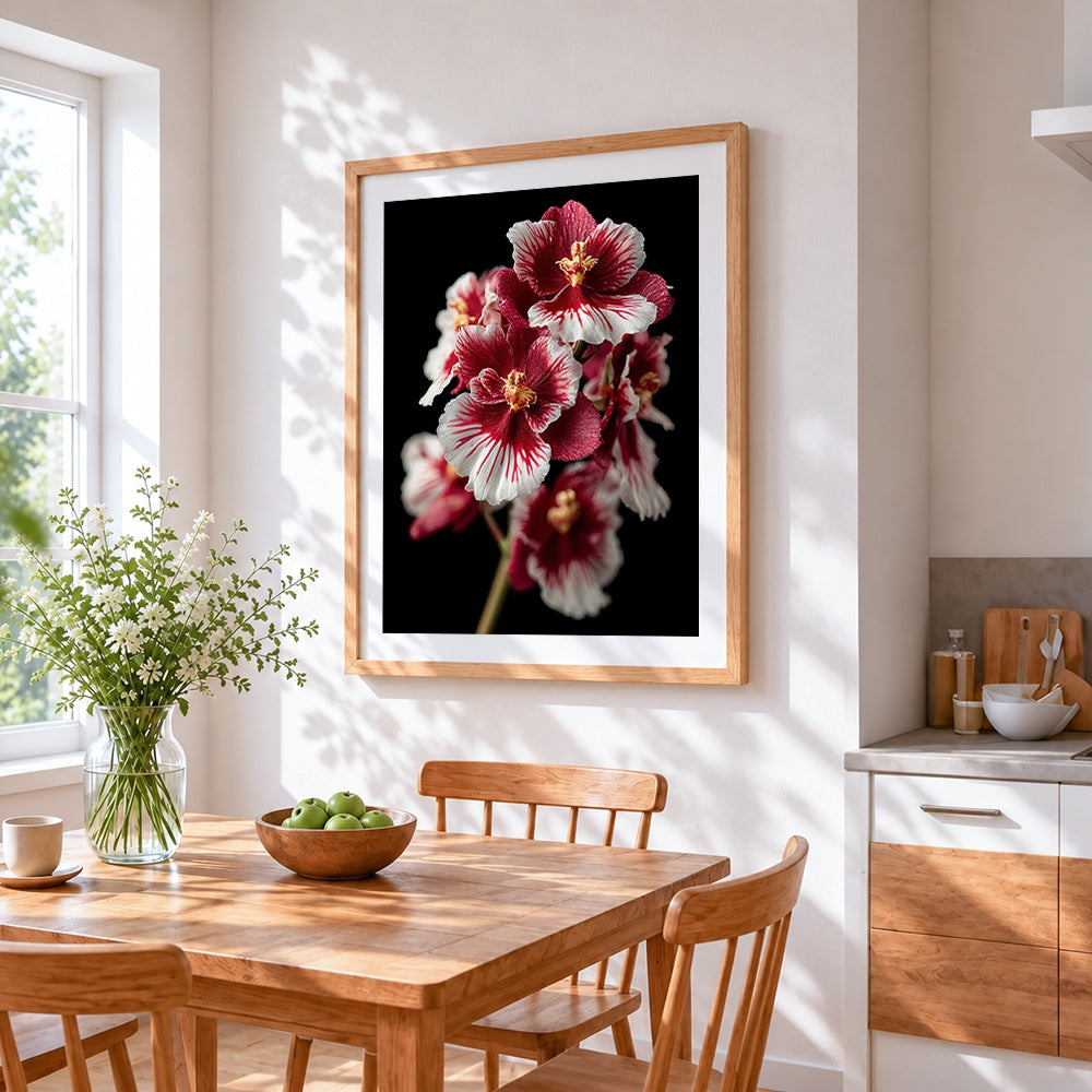 Red and white orchids on black background cross stitch artwork displayed on wall as home decor