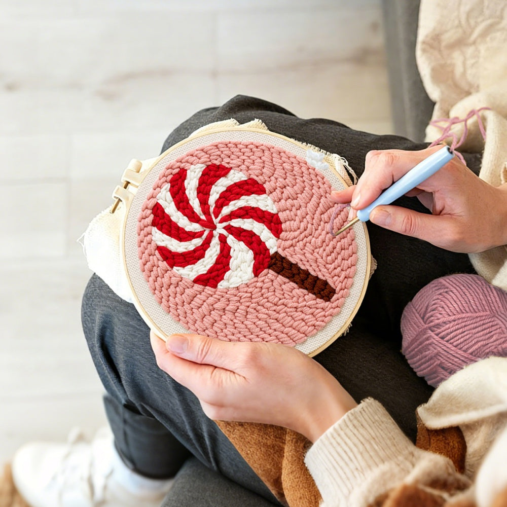 Creating handmade red and white swirl lollipop unch needle artwork