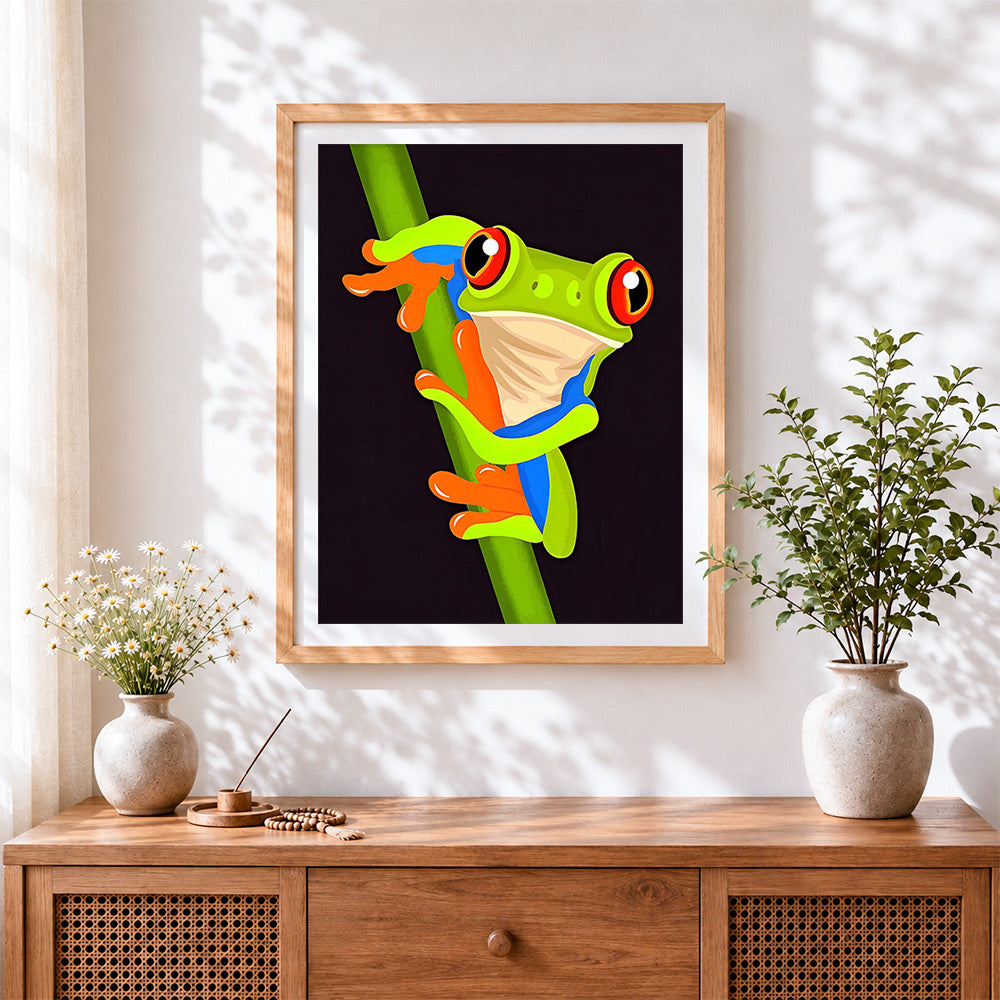 Finished red eyed tree frog on a branch cross stitch artwork displayed