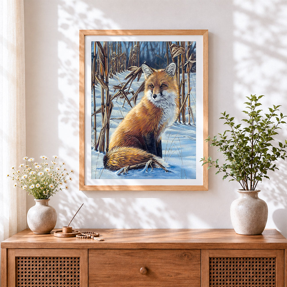 Finished red fox in a snowy field cross stitch artwork displayed