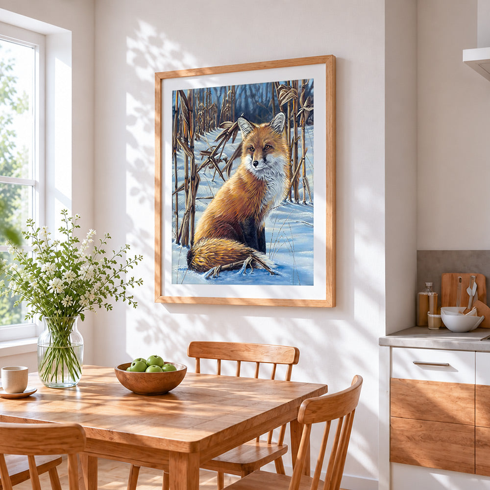 Red fox in a snowy field cross stitch artwork displayed on wall as home decor