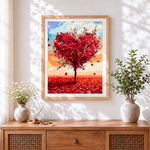 Finished red heart-shaped tree in autumn cross stitch artwork displayed