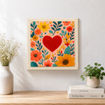 Finished red heart surrounded by colourful blooms artwork displayed on a wall