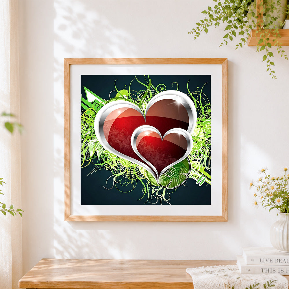 Finished red hearts and green vines cross stitch artwork displayed