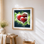 Red hearts and green vines cross stitch artwork displayed on wall as home decor