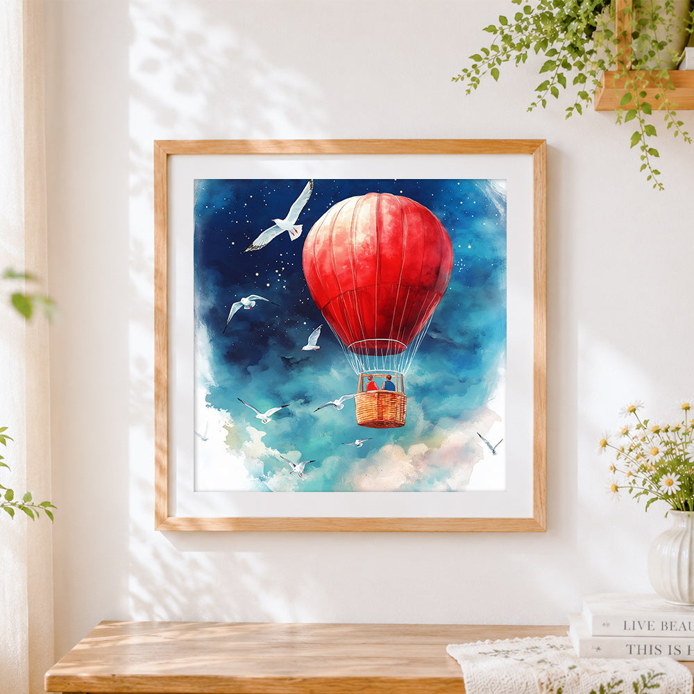Finished red hot air balloon and seagulls cross stitch artwork displayed