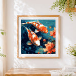 Finished red koi fish and lotus cross stitch artwork displayed