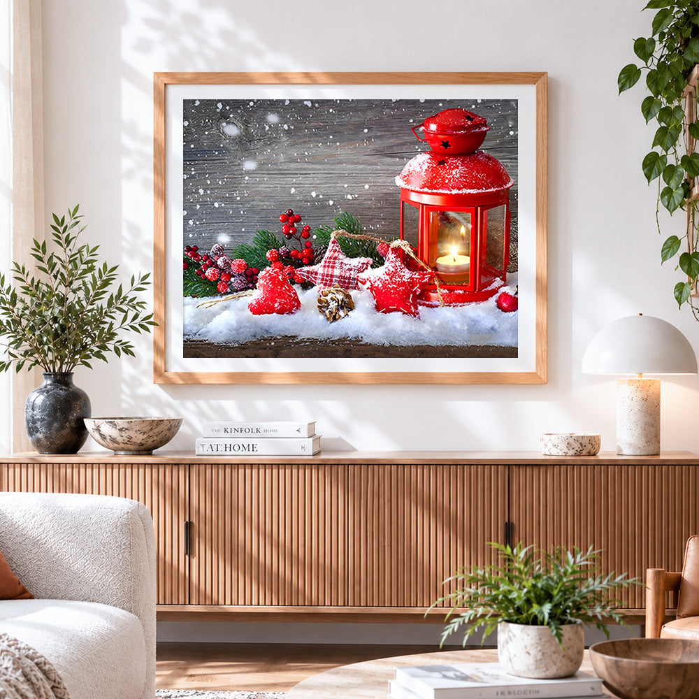 Finished red lantern and snowy stars cross stitch artwork displayed