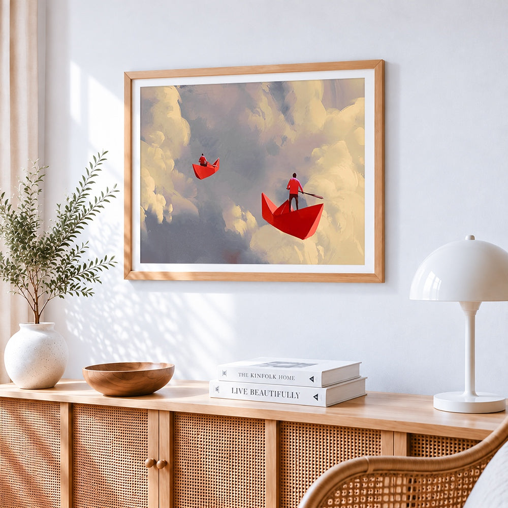 Red paper boats in the clouds cross stitch artwork displayed on wall as home decor
