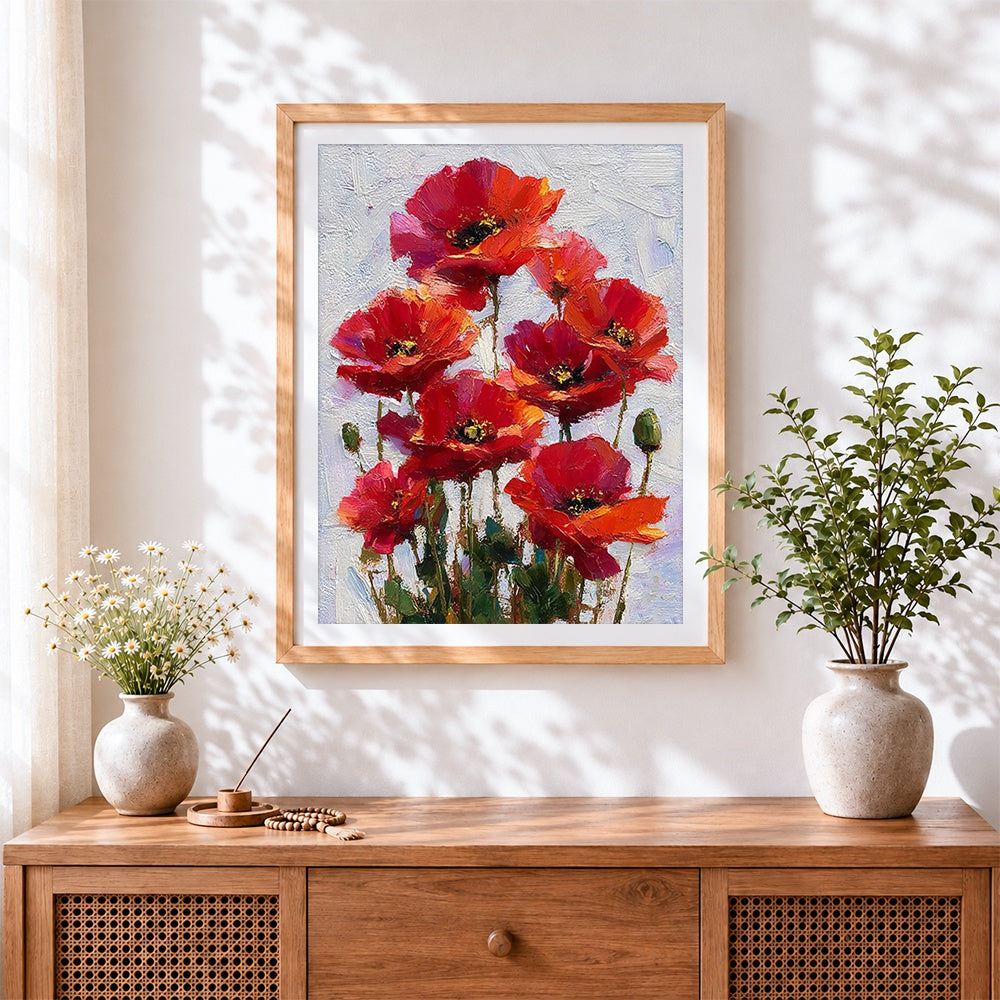 Finished red poppies cross stitch artwork displayed