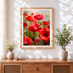 Finished red poppies in a field cross stitch artwork displayed