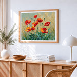 Red poppies in a golden wheat field cross stitch artwork displayed on wall as home decor