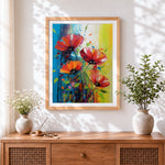 Finished red poppies with green splashes cross stitch artwork displayed