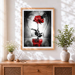 Finished red rose in lightbulb with butterfly cross stitch artwork displayed
