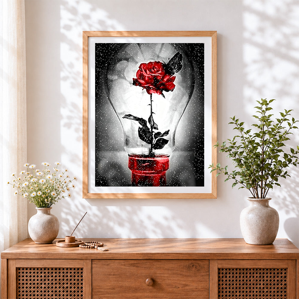 Finished red rose in lightbulb with butterfly cross stitch artwork displayed