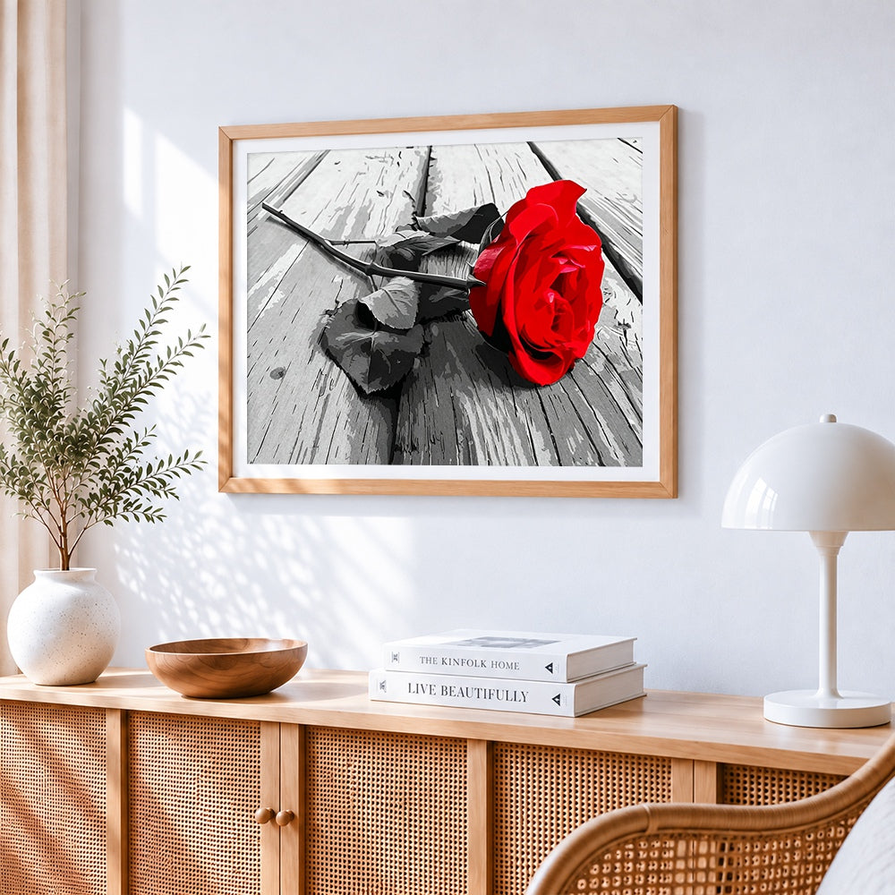 Red rose on weathered wood paint by numbers artwork displayed on wall as home decor