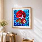 Red roses and colourful butterflies cross stitch artwork displayed on wall as home decor