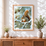 Finished red squirrel with pine cones in snow cross stitch artwork displayed