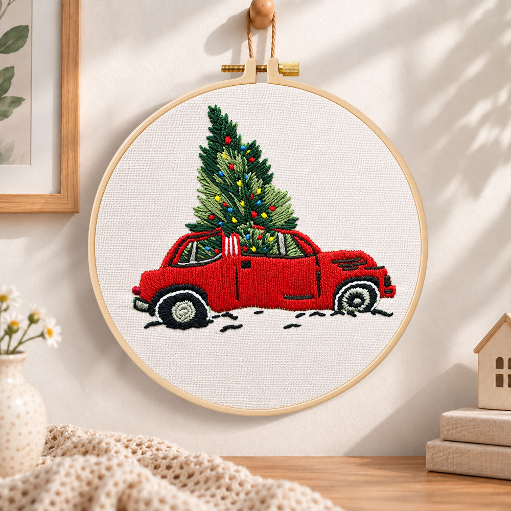 Red truck christmas tree embroidery hoop wall art displayed as warm and cozy handmade home decor