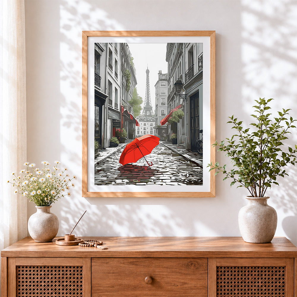 Finished red umbrella in a parisian street cross stitch artwork displayed
