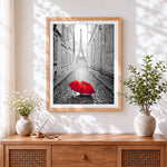 Finished red umbrella in paris cross stitch artwork displayed