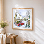 Red vintage car with christmas tree in snow cross stitch artwork displayed on wall as home decor