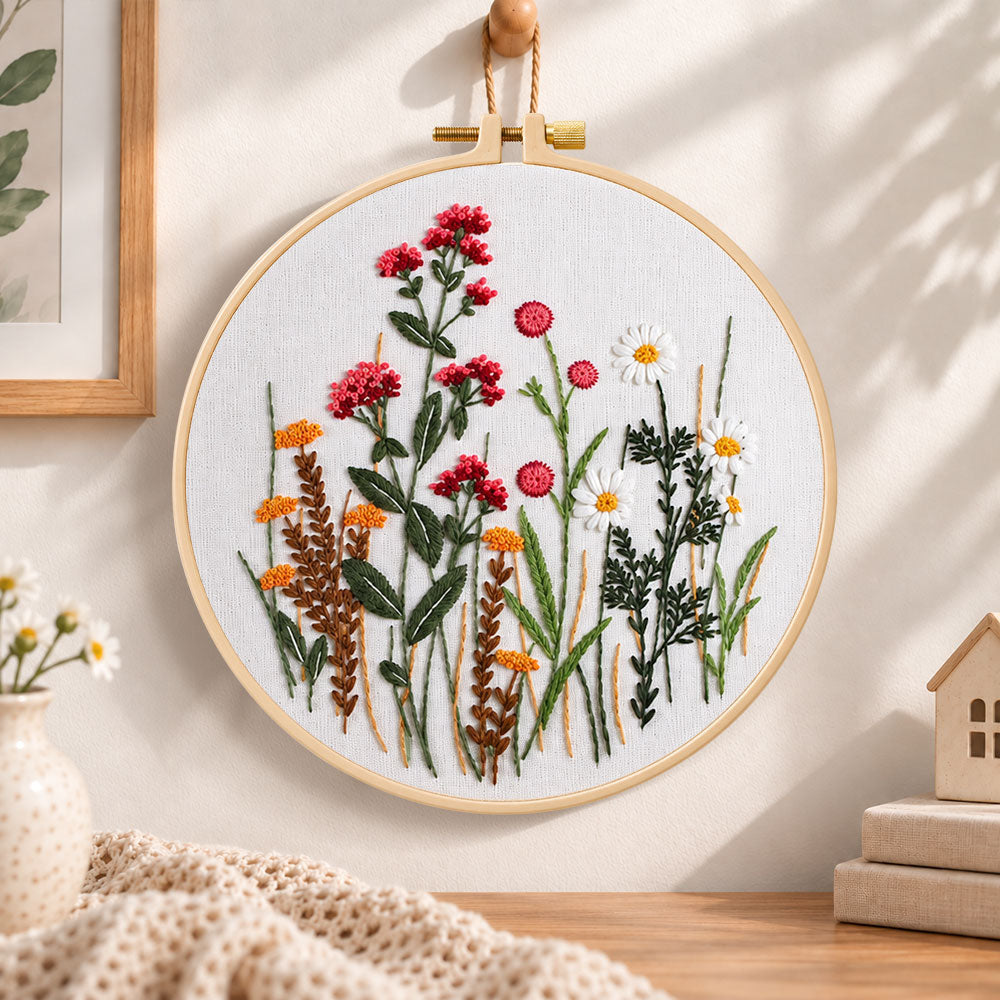 Red wildflower bouquet embroidery hoop wall art displayed as warm and cosy handmade home decor