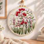 Red wildflower patch embroidery hoop wall art displayed as warm and cosy handmade home decor