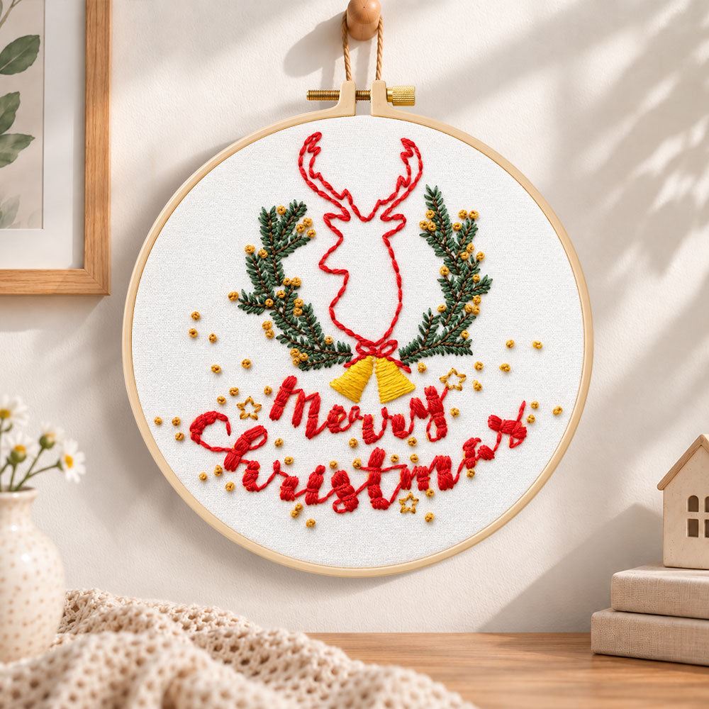 Reindeer and christmas text embroidery hoop wall art displayed as warm and cozy handmade home decor
