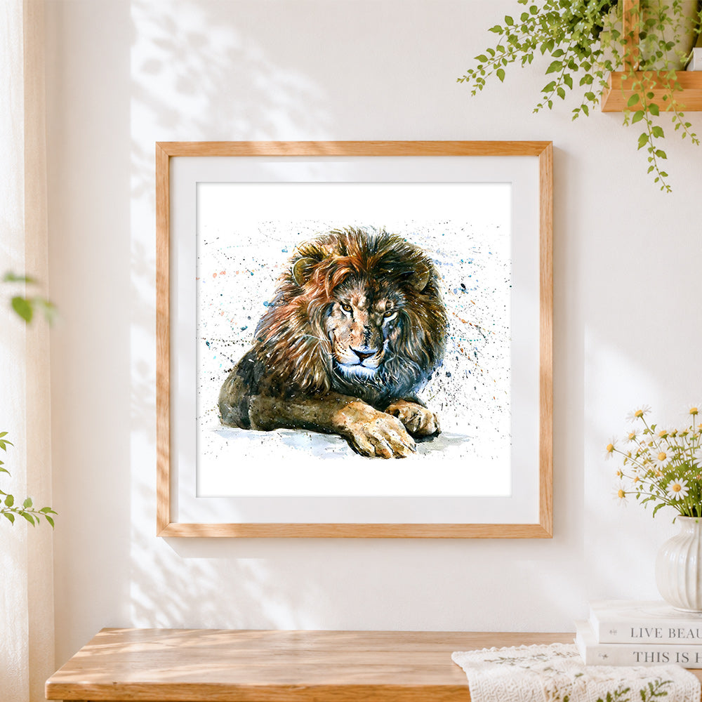 Finished resting lion cross stitch artwork displayed