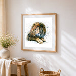 Resting lion cross stitch artwork displayed on wall as home decor