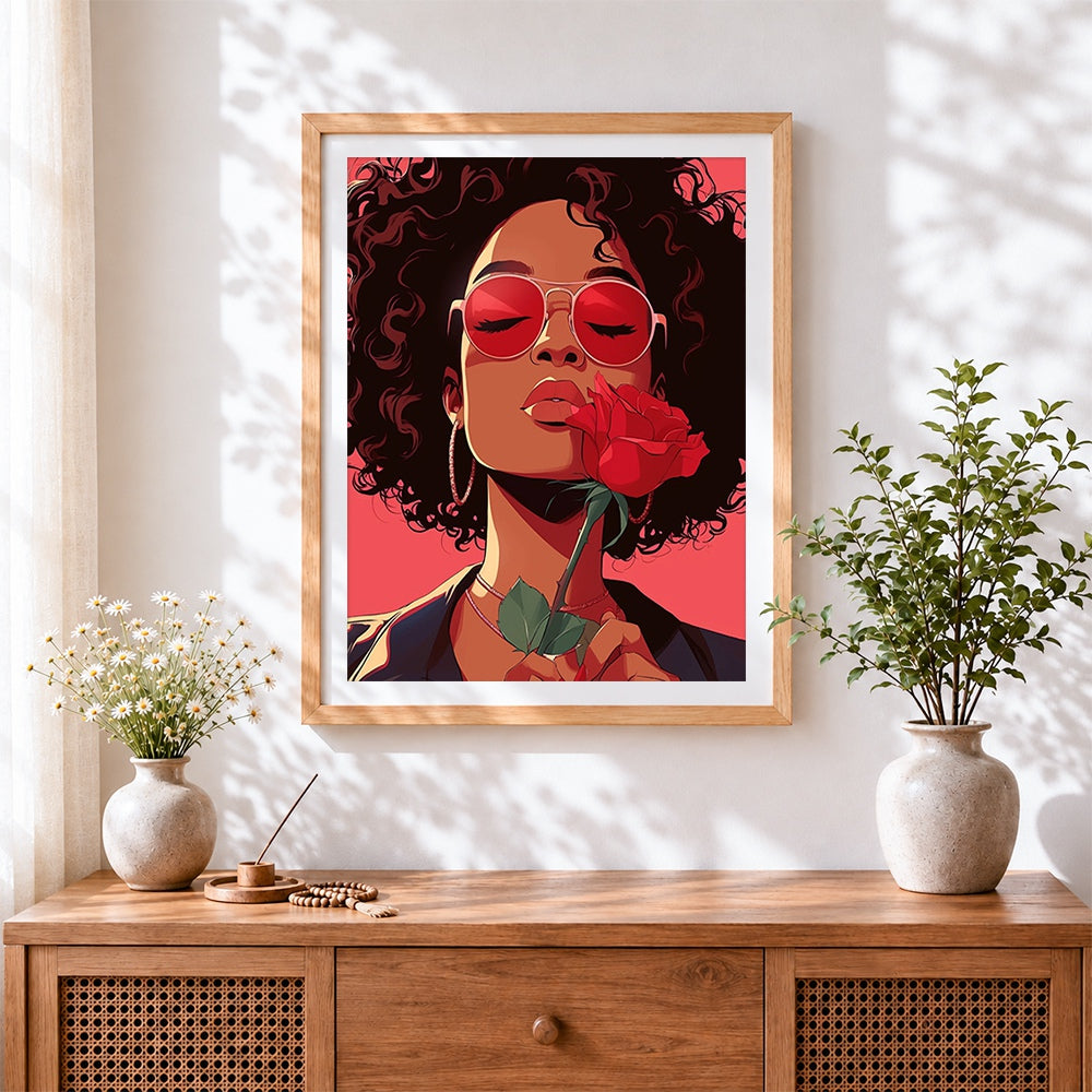 Finished retro woman with red sunglasses and rose cross stitch artwork displayed