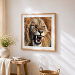 Roaring lion close-up cross stitch artwork displayed on wall as home decor
