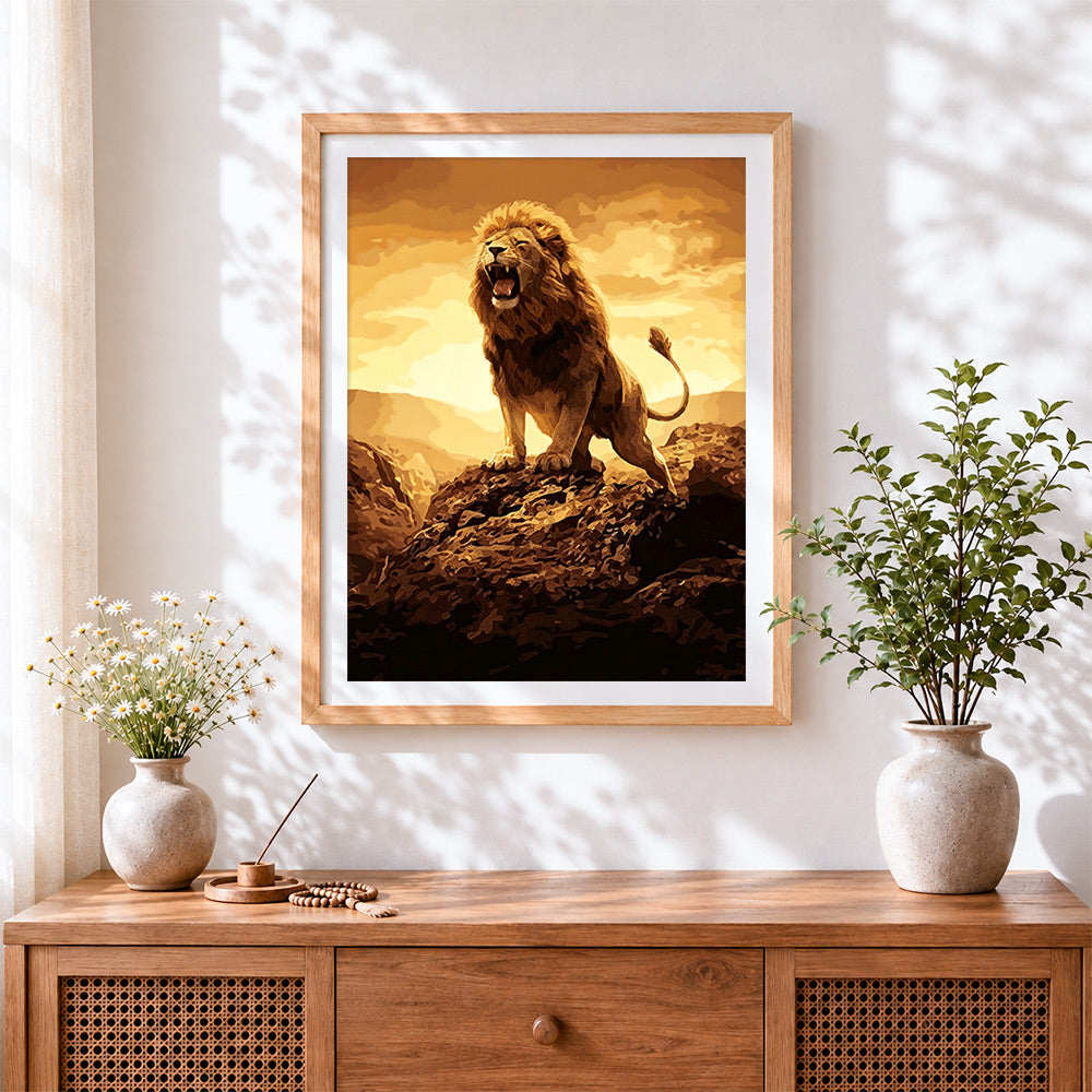 Finished roaring lion on rock cross stitch artwork displayed